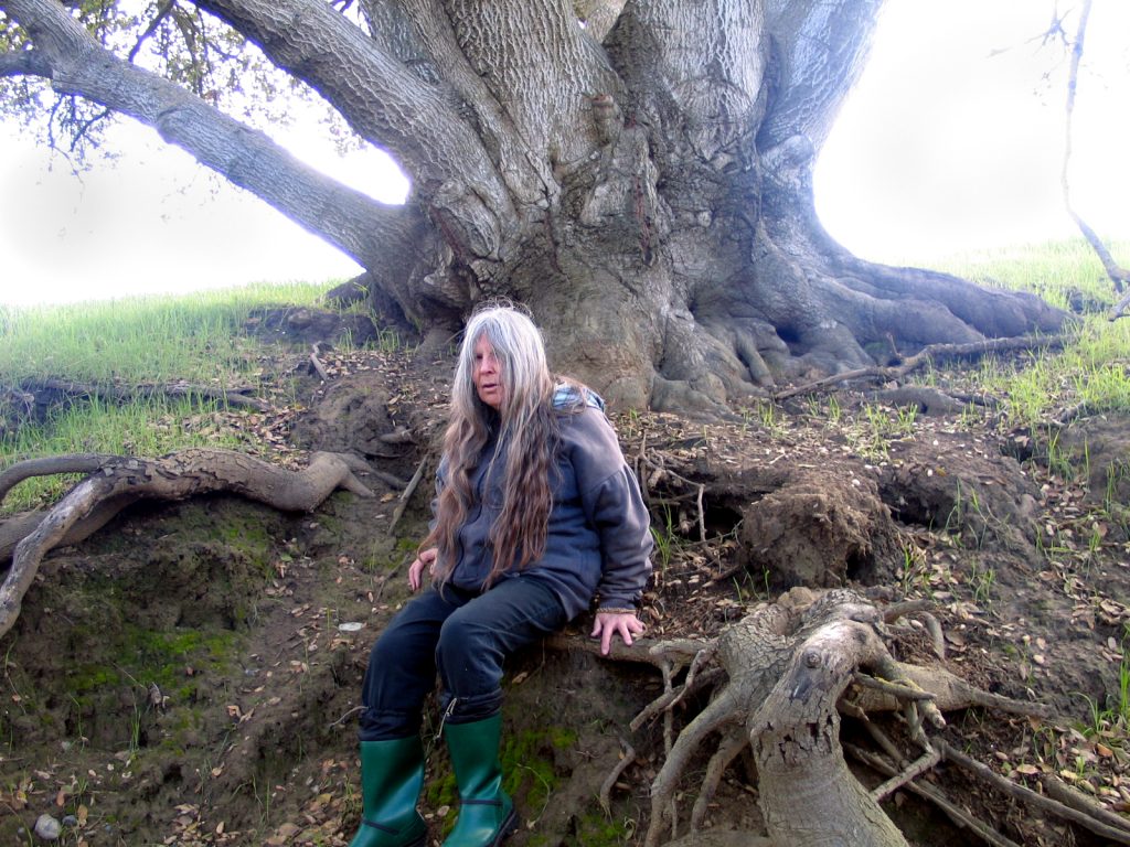 Frances at root of her spirit tree